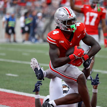 Aug 31, 2024; Columbus, Ohio, USA;  Ohio State Buckeyes wide receiver Jeremiah Smith (4) makes a long catch against the Akron Zips during the second half at Ohio Stadium.