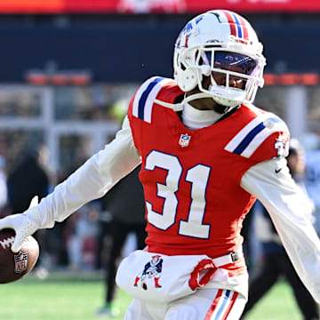 Dec 1, 2024; Foxborough, Massachusetts, USA; New England Patriots cornerback Jonathan Jones (31) warms up before a game against the Indianapolis Colts at Gillette Stadium. Mandatory Credit: Eric Canha-Imagn Images