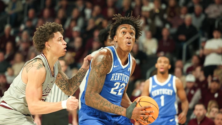 Jan 11, 2025; Starkville, Mississippi, USA; Kentucky Wildcats center Amari Williams (22) drives to the basket against Mississippi State Bulldogs guard Riley Kugel (2) during the first half at Humphrey Coliseum. Mandatory Credit: Wesley Hale-Imagn Images