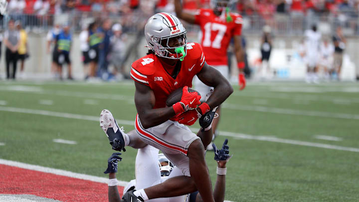 Aug 31, 2024; Columbus, Ohio, USA;  Ohio State Buckeyes wide receiver Jeremiah Smith (4) makes a long catch against the Akron Zips during the second half at Ohio Stadium.