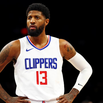 Apr 9, 2024; Phoenix, Arizona, USA;  LA Clippers forward Paul George (13) looks on during the first quarter of the game against the Phoenix Suns at Footprint Center. Mandatory Credit: