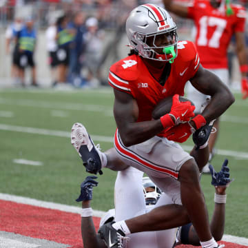 Aug 31, 2024; Columbus, Ohio, USA;  Ohio State Buckeyes wide receiver Jeremiah Smith (4) makes a long catch against the Akron Zips during the second half at Ohio Stadium.