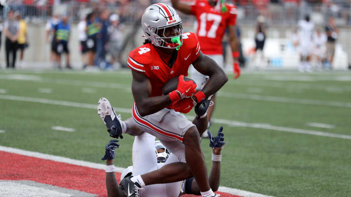 Aug 31, 2024; Columbus, Ohio, USA;  Ohio State Buckeyes wide receiver Jeremiah Smith (4) makes a long catch against the Akron Zips during the second half at Ohio Stadium.