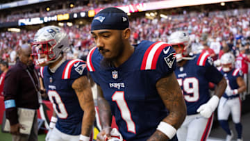 Dec 15, 2024; Glendale, Arizona, USA; New England Patriots wide receiver Ja'Lynn Polk (1) against the Arizona Cardinals at State Farm Stadium. Mandatory Credit: Mark J. Rebilas-Imagn Images