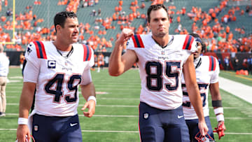 Sep 8, 2024; Cincinnati, Ohio, USA; New England Patriots tight end Hunter Henry (85) and long snapper Joe Cardona (49) celebrate following the win over the Cincinnati Bengals at Paycor Stadium. Mandatory Credit: Joseph Maiorana-Imagn Images
