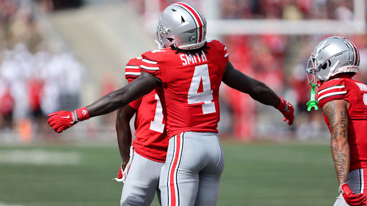 Aug 31, 2024; Columbus, Ohio, USA;  Ohio State Buckeyes wide receiver Jeremiah Smith (4) celebrates after scoring a touchdown against the Akron Zips during the first quarter at Ohio Stadium.