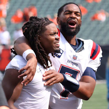 Sep 8, 2024; Cincinnati, Ohio, USA;  New England Patriots quarterback Jacoby Brissett (right) celebrates following the win over the Cincinnati Bengals at Paycor Stadium. Mandatory Credit: Joseph Maiorana-Imagn Images