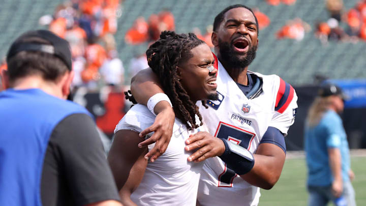 Sep 8, 2024; Cincinnati, Ohio, USA;  New England Patriots quarterback Jacoby Brissett (right) celebrates following the win over the Cincinnati Bengals at Paycor Stadium. Mandatory Credit: Joseph Maiorana-Imagn Images