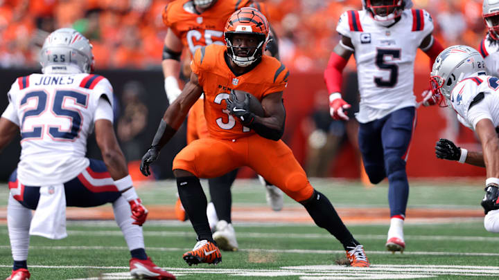 Sep 8, 2024; Cincinnati, Ohio, USA;  Cincinnati Bengals running back Zack Moss (31) runs the ball during the first quarter against the New England Patriots at Paycor Stadium. Mandatory Credit: Joseph Maiorana-Imagn Images