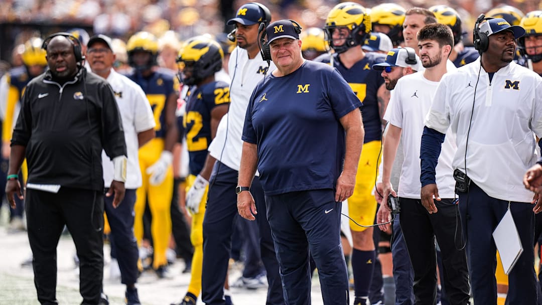 Michigan acting head coach Biff Poggi watches a play against Central Michigan 