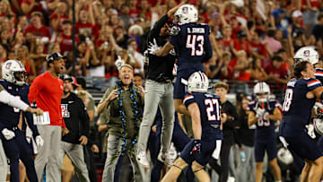 Oct 5, 2024; Tucson, Arizona, USA; Arizona Wildcats defensive back Dalton Johnson (43) celebrates turnover with team during third quarter against Texas Tech Red Raiders at Arizona Stadium. Mandatory Credit: Aryanna Frank-Imagn Images