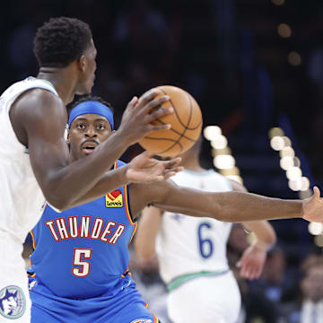 Jan 29, 2024; Oklahoma City, Oklahoma, USA; Oklahoma City Thunder guard Luguentz Dort (5) defends Minnesota Timberwolves guard Anthony Edwards (5)