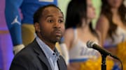 Feb 13, 2024; Los Angeles, CA, USA;  UCLA Bruins athletic director Martin Jarmond listens as DeShaun Foster speaks to media after he was introduced as the new head football coach during a press conference at Pauley Pavilion.  Mandatory Credit: Jayne Kamin-Oncea-Imagn Images