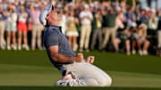 Rory McIlroy celebrates after sinking a putt to win the 2025 Masters.