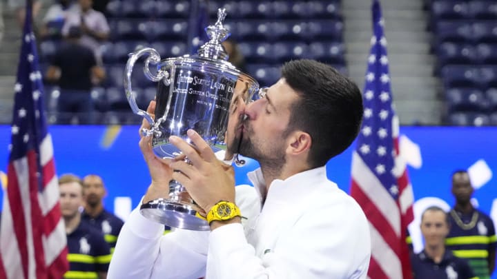 Sep 10, 2023; Flushing, NY, USA; Novak Djokovic of Serbia celebrates with the championship trophy after his match against Daniil Medvedev (not pictured) in the men's singles final on day fourteen of the 2023 U.S. Open tennis tournament at USTA Billie Jean King National Tennis Center. Mandatory Credit: Robert Deutsch-USA TODAY Sports