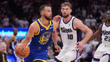 Apr 16, 2024; Sacramento, California, USA; Golden State Warriors guard Stephen Curry (30) dribbles the ball in front of Sacramento Kings forward Domantas Sabonis (10) in the fourth quarter during a play-in game of the 2024 NBA playoffs at the Golden 1 Center. Mandatory Credit: Cary Edmondson-USA TODAY Sports