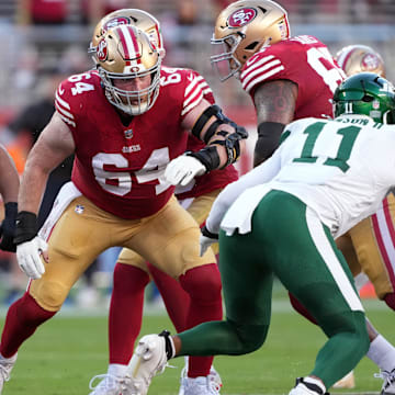 Sep 9, 2024; Santa Clara, California, USA; San Francisco 49ers center Jake Brendel (64) blocks against New York Jets linebacker Jermaine Johnson (11) during the second quarter at Levi's Stadium. Mandatory Credit: Darren Yamashita-Imagn Images