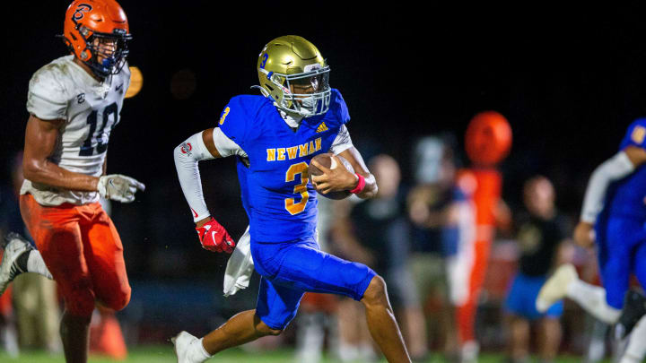 Cardinal Newman wide receiver Naeshaun Montgomery runs down the field against Benjamin in their regional semifinal playoff football game in West Palm Beach on November 17, 2023.