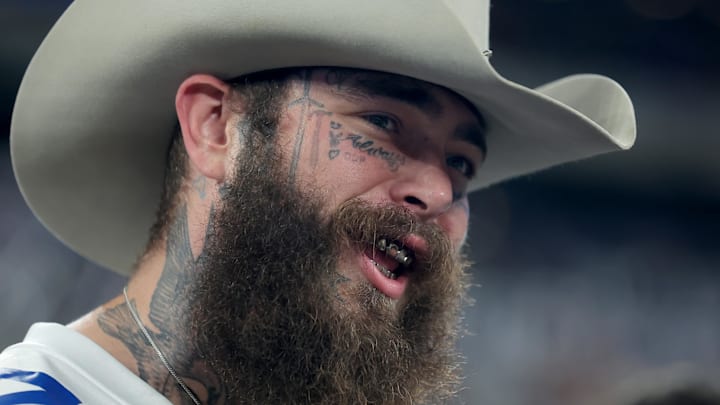 American recording artist Post Malone on the field before a game between the New York Giants and the Dallas Cowboys.