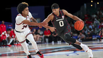 Nov 29, 2024; Paradise Island, Bahamas, BHS;  Oklahoma Sooners guard Jeremiah Fears (0) drives to the basket as Louisville Cardinals guard Chucky Hepburn (24) defends during the second half at Imperial Arena at the Atlantis resort.  Mandatory Credit: Kevin Jairaj-Imagn Images