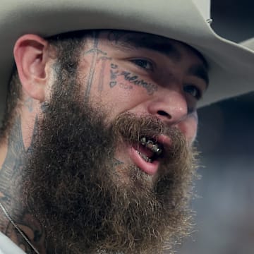 American recording artist Post Malone on the field before a game between the New York Giants and the Dallas Cowboys.