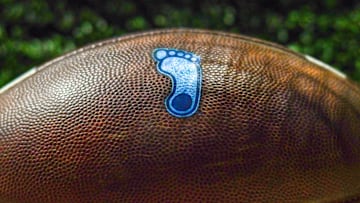 Oct 30, 2021; South Bend, Indiana, USA; A detail of the North Carolina Tar Heels logo on a football during the game against the Notre Dame Fighting Irish at Notre Dame Stadium. Mandatory Credit: Matt Cashore-Imagn Images