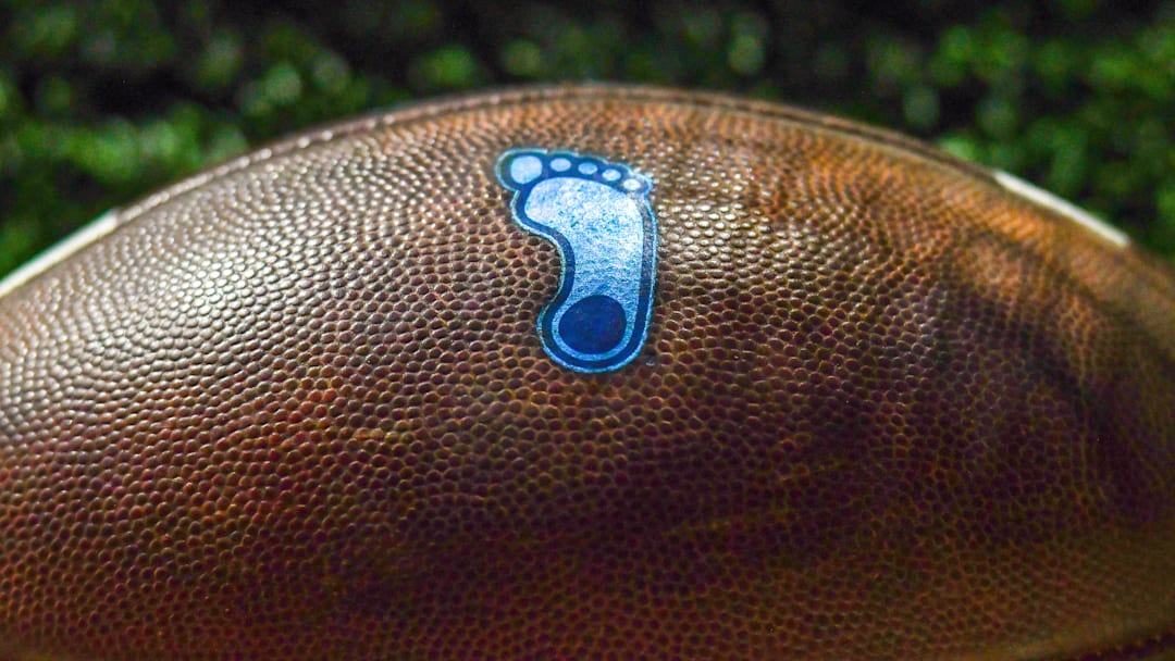 Oct 30, 2021; South Bend, Indiana, USA; A detail of the North Carolina Tar Heels logo on a football during the game against the Notre Dame Fighting Irish at Notre Dame Stadium. Mandatory Credit: Matt Cashore-Imagn Images