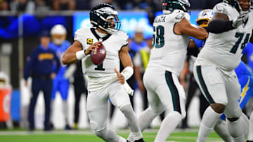 Dec 8, 2025; Inglewood, California, USA; Philadelphia Eagles quarterback Jalen Hurts (1) looks to pass against the Los Angeles Chargers in the first half at SoFi Stadium. Mandatory Credit: Gary A. Vasquez-Imagn Images