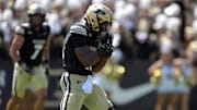 Purdue Boilermakers linebacker Mani Powell (16) celebrates a sack