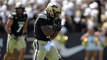 Purdue Boilermakers linebacker Mani Powell (16) celebrates a sack