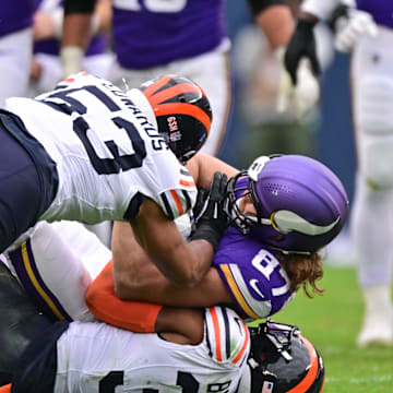 Nov 24, 2024; Chicago, Illinois, USA; Minnesota Vikings tight end T.J. Hockenson (87) is tacked after a reception by Chicago Bears linebacker T.J. Edwards (53) and free safety Kevin Byard (31) during the third quarter at Soldier Field. Mandatory Credit: Daniel Bartel-Imagn Images