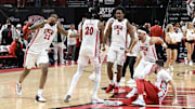 UNLV Rebels forward Karl Jones (22), forward Keylan Boone (20), guard Shane Nowell (3) and guard Justin Webster (2) celebrate the win over San Diego State Aztecs at Thomas & Mack Center. 