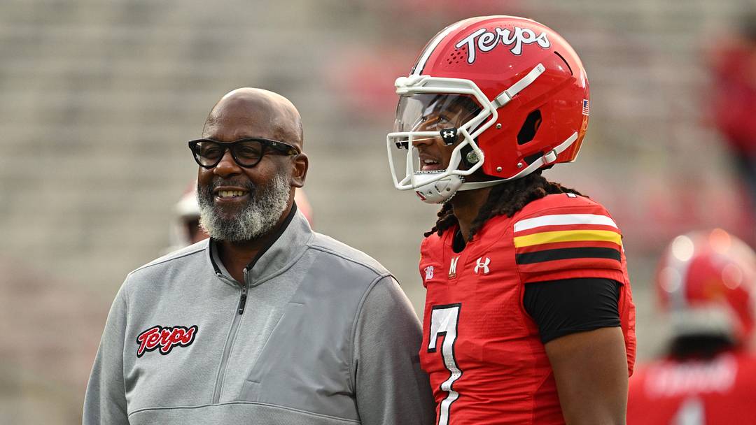 Sep 5, 2025; College Park, Maryland, USA; Maryland Terrapins head coach Mike Locksley talks with quarterback Malik Washington during pre-game warm ups before a game against the Northern Illinois Huskies at SECU Stadium. Photo by Jamie Sabau 