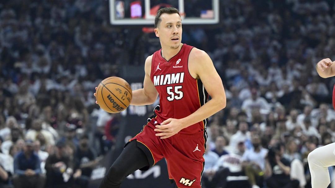 Apr 20, 2025; Cleveland, Ohio, USA; Miami Heat forward Duncan Robinson (55) dribbles the ball in the first quarter against the Cleveland Cavaliers at Rocket Arena. Mandatory Credit: David Richard-Imagn Images