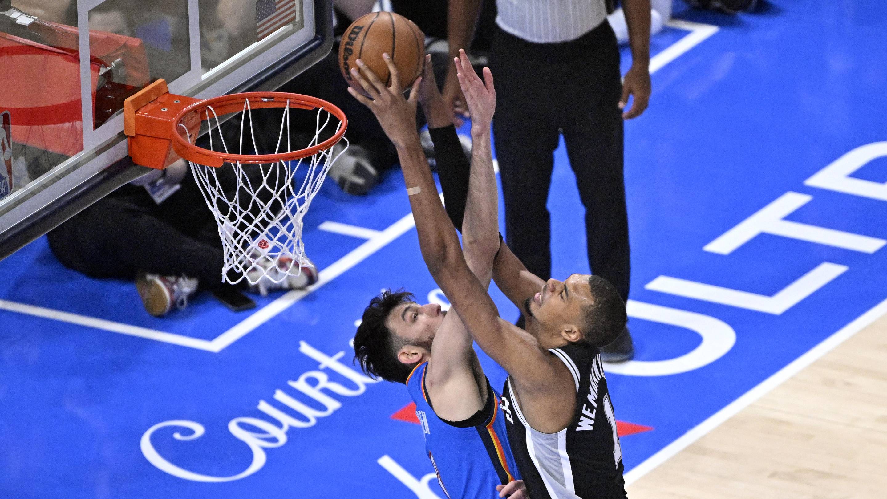 May 30, 2026; Oklahoma City, Oklahoma, USA; San Antonio Spurs forward Victor Wembanyama (1) shoots against Oklahoma City Thunder center Chet Holmgren (7) in the first quarter during game seven of the western conference finals for the 2026 NBA playoffs at Paycom Center. Mandatory Credit: Jerome Miron-Imagn Images
