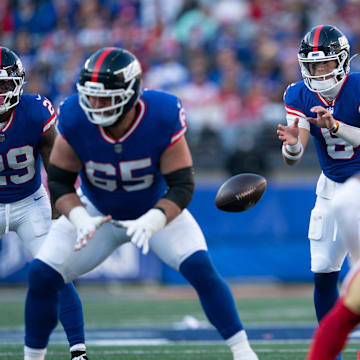 New York Giants quarterback Jaxson Dart (6) receives a snap from New York Giants center Austin Schlottmann (65) during a week 9 game between New York Giants and San Francisco 49ers at MetLife Stadium on Sunday, Nov. 2, 2025.