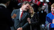 Andrea Doan hugs her husband Shane Doan as he receives a standing ovation during his jersey retirement ceremony at Gila River Arena in Glendale, Ariz. on February 24, 2019.