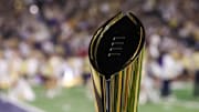 Nov 22, 2025; Atlanta, Georgia, USA; A view of the college football playoff national championship trophy on the sidelines of a game between the Georgia Tech Yellow Jackets and Pittsburgh Panthers in the first quarter at Bobby Dodd Stadium at Hyundai Field.