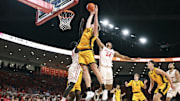 Nov 12, 2025; Houston, Texas, USA; Oakland Golden Grizzlies forward Isaac Garrett (32) attempts to grab a rebound away from Houston Cougars forward Chase McCarty (24) during the first half at Fertitta Center. Mandatory Credit: Troy Taormina-Imagn Images