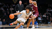 Nov 20, 2025; Nashville, Tennessee, USA;  Vanderbilt Commodores guard Tyler Tanner (3) drives baseline past Texas Southern Tigers forward Anthony Andrews (8) during the second half at Memorial Gymnasium. Mandatory Credit: Steve Roberts-Imagn Images