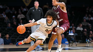 Nov 20, 2025; Nashville, Tennessee, USA;  Vanderbilt Commodores guard Tyler Tanner (3) drives baseline past Texas Southern Tigers forward Anthony Andrews (8) during the second half at Memorial Gymnasium. Mandatory Credit: Steve Roberts-Imagn Images