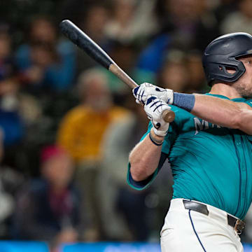 Seattle Mariners first baseman Luke Raley (20) hits a two-run home run during the ninth inning against the Oakland Athletics at T-Mobile Park in 2024.