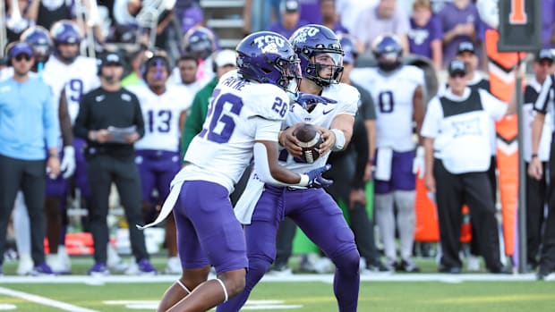 TCU Horned Frogs quarterback Josh Hoover (10) takes a handoff to running back Jeremy Payne during the fourth quarter.