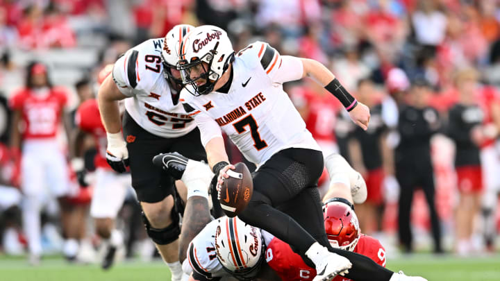 Nov 18, 2023; Houston, Texas, USA; Oklahoma State Cowboys quarterback Alan Bowman (7) runs the ball against the Houston Cougars during the first half at TDECU Stadium. Mandatory Credit: Maria Lysaker-USA TODAY Sports