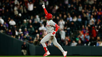 May 19, 2025; Denver, Colorado, USA; Philadelphia Phillies third baseman Alec Bohm (28) gestures as he rounds the bases on a two run home run in the eighth inning against the Colorado Rockies at Coors Field. 