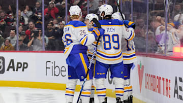 The Sabres celebrating a goal against the Ottawa Senators.
