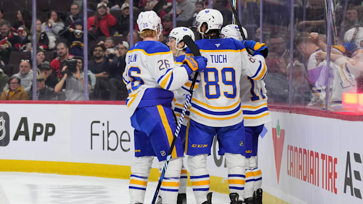 The Sabres celebrating a goal against the Ottawa Senators.