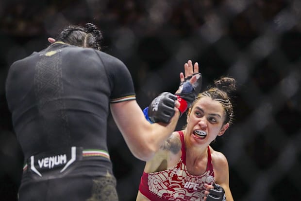 Irene Aldana (red gloves) fights Norma Dumont (blue gloves) during Riyadh Season Noche UFC 306 at Sphere. 