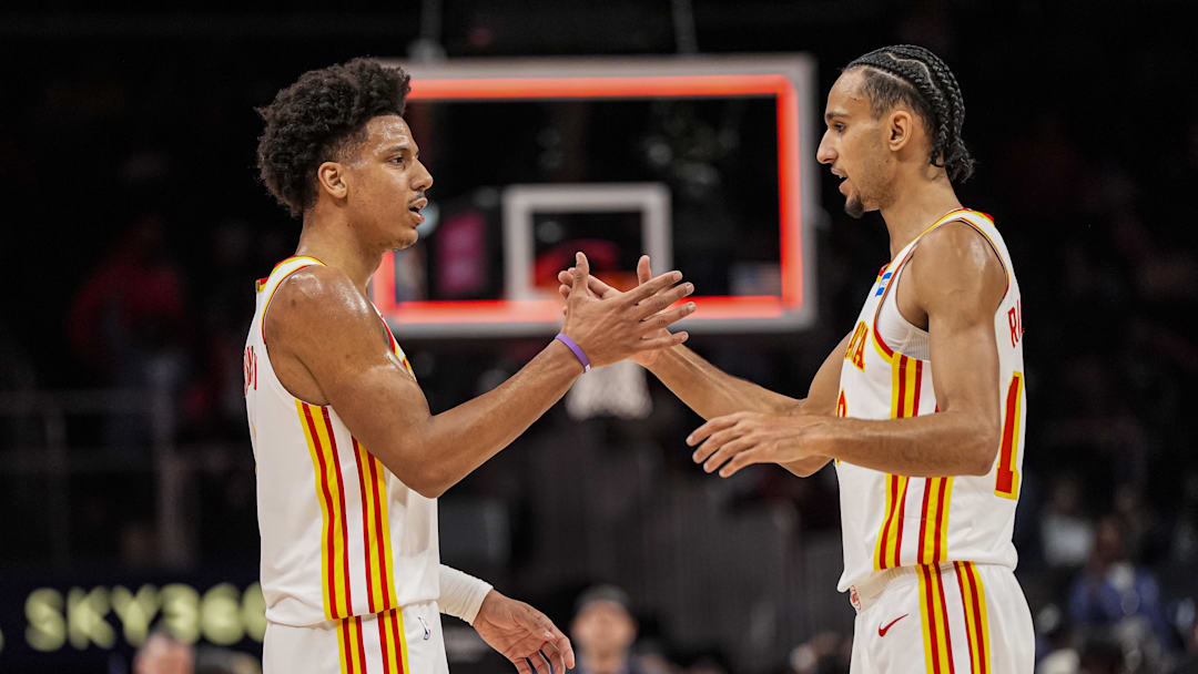Mar 12, 2026; Atlanta, Georgia, USA; Atlanta Hawks forwards Jalen Johnson (1) and Zaccharie Risacher (10) react after the Hawks defeated the Brooklyn Nets at State Farm Arena. Mandatory Credit: Dale Zanine-Imagn Images