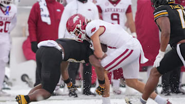 Nov 30, 2024; Columbia, Missouri, USA; Arkansas Razorbacks wide receiver Isaac TeSlaa (4) runs the hall as Missouri Tigers safety Daylan Carnell (13) makes the tackle during the first half at Faurot Field at Memorial Stadium. Mandatory Credit: Denny Medley-Imagn Images